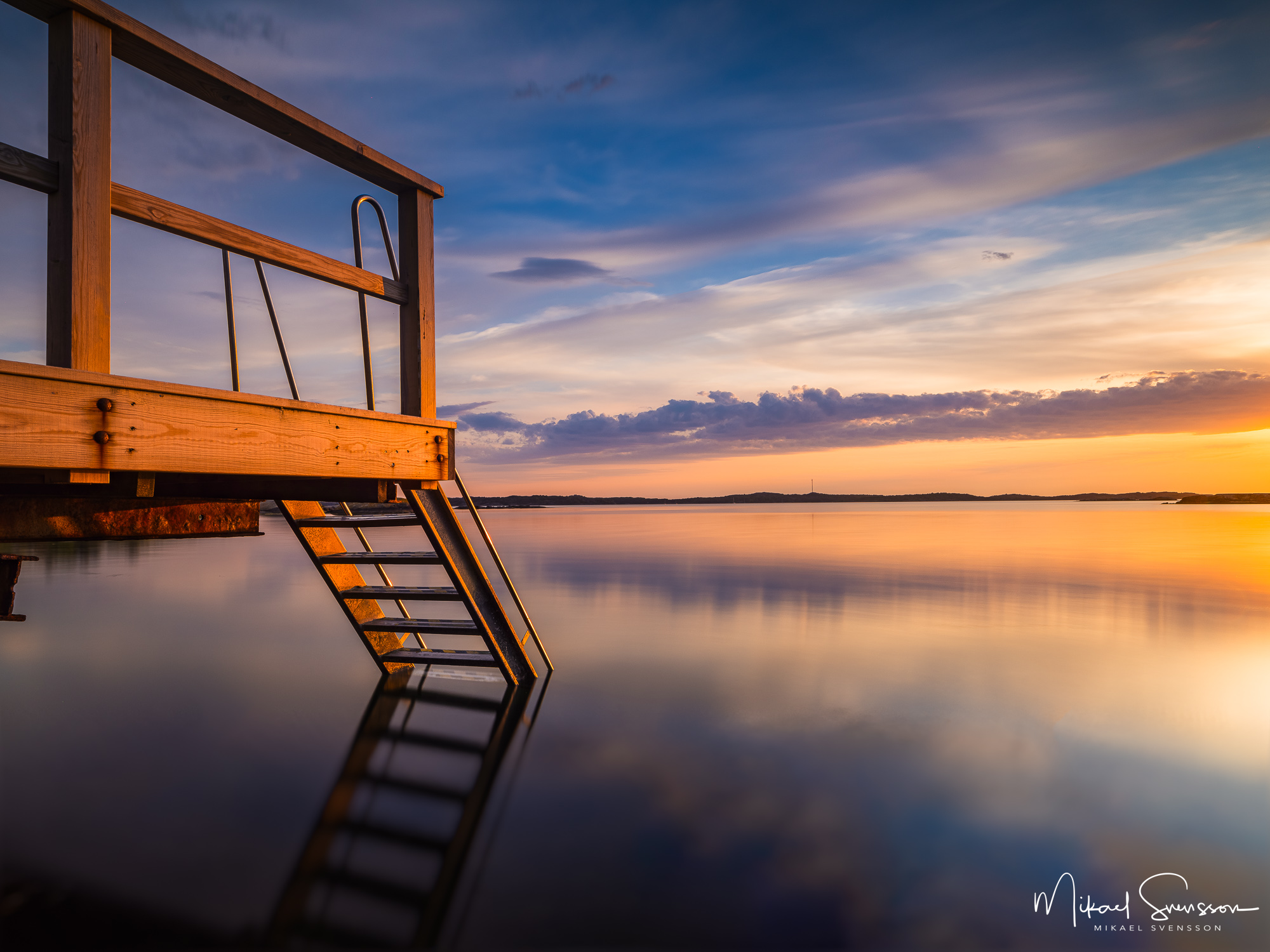Solnedgång vid badstege i Lilleby, Hisingen.